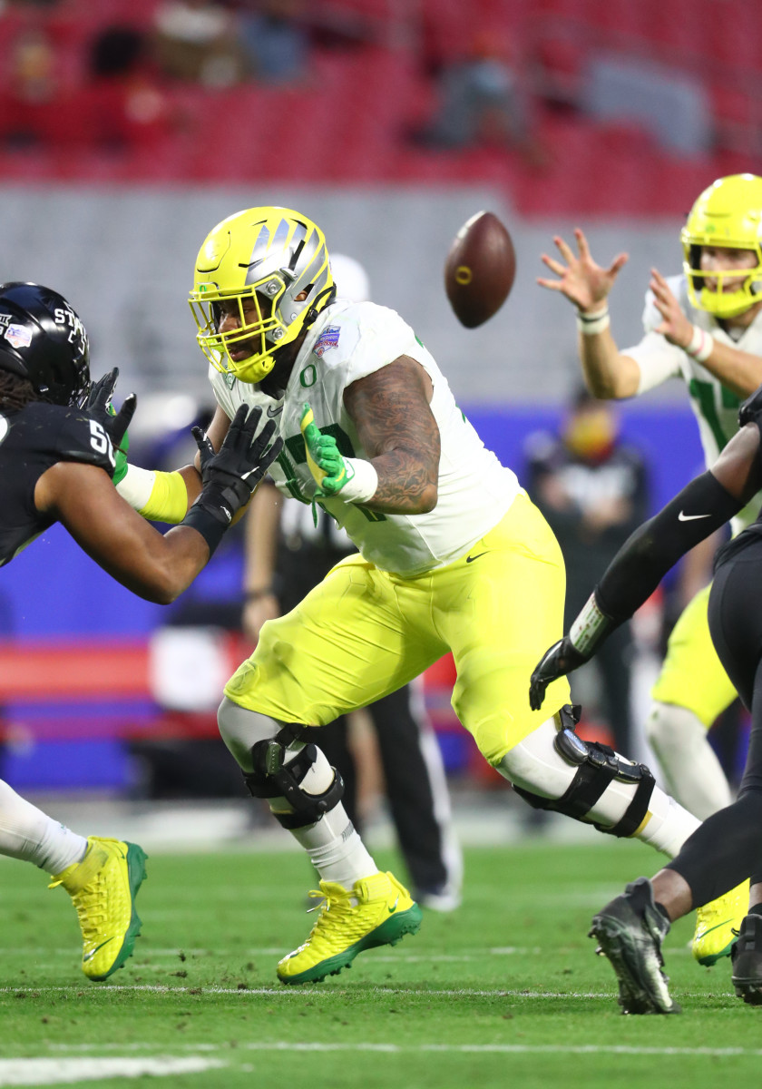 George Moore blocks an Iowa State defensive lineman in the 2021 Playstation Fiesta Bowl.